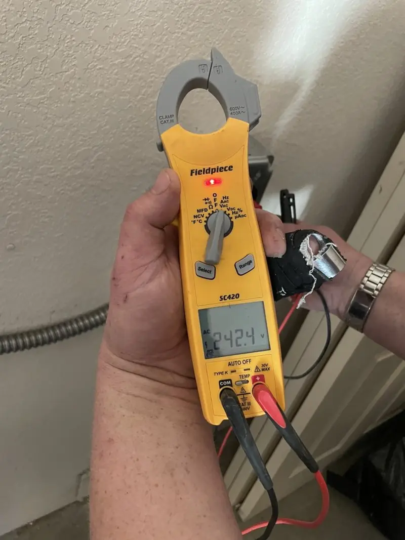 Voltage testing with clamp meter during Ceiling Fan Installation in Auburn